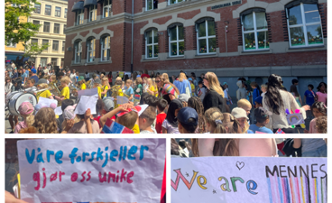 en gruppe mennesker som holder skilt